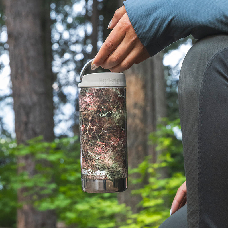 12oz-tkwide-with-twist-cap-mossy-oak-u8 12oz_tumbler_mossyoak_rainbowtrout_hand_closeup_square.jpg