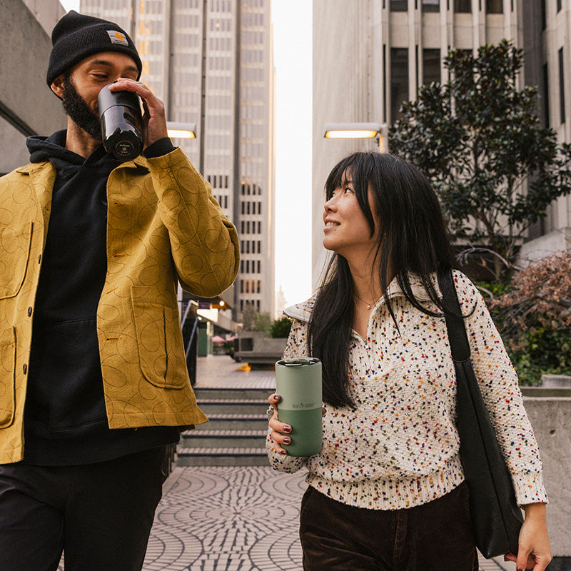 bring-your-own-party-kit-pints-and-tumblers-q1 16oz_rise_tumbler_black_iceberg_couple_drink_city_street_square.jpg