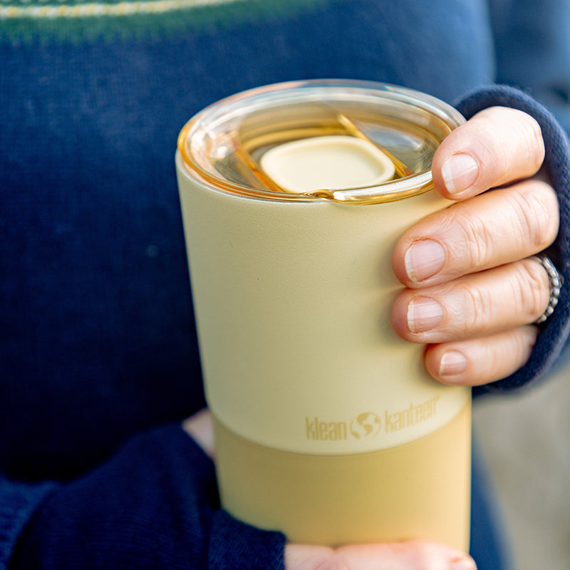 daily-on-the-go-set-g6 16oz_rise_tumbler_wax_yellow_closeup_hand_lid_square.jpg