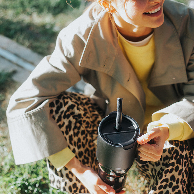 26oz-rise-tumbler-with-straw-lid-w3 26oz_rise_tumbler_black_woman_topview_square.jpg